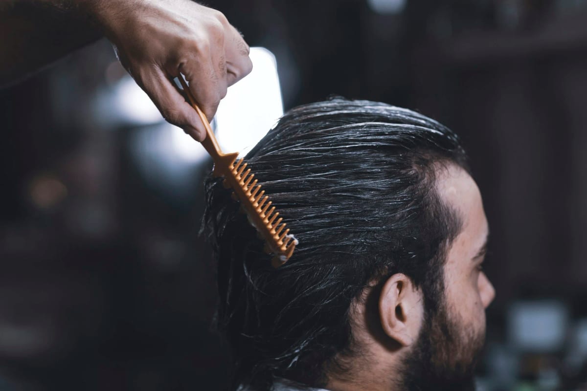 Detail of a comb through wet hair